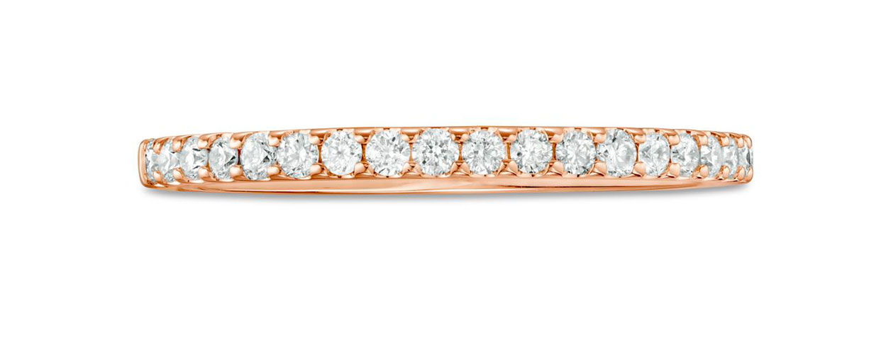 Diamonds Direct Diamond eternity band in rose gold displayed on a white background.
